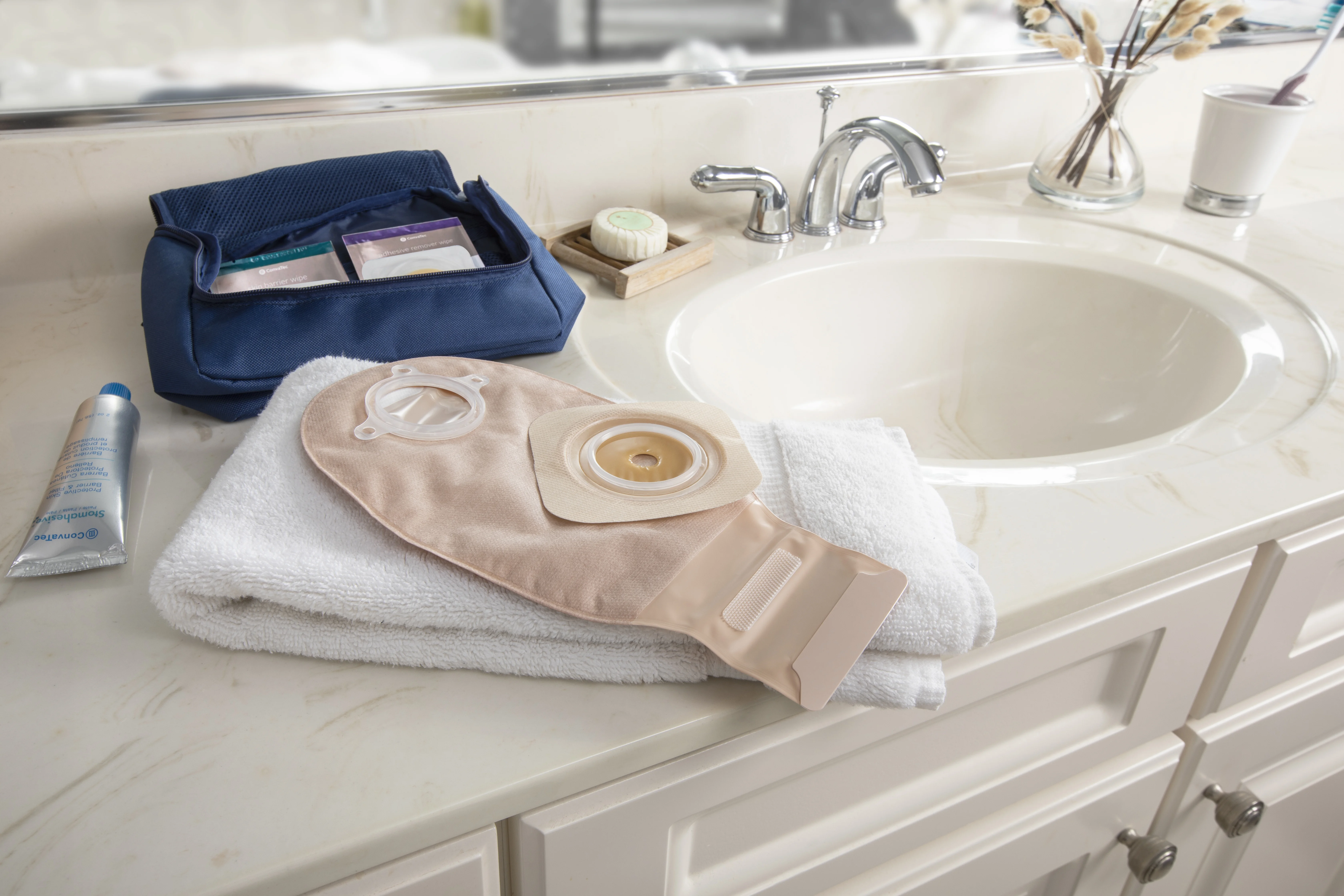 Ostomy product routine bathroom counter image with esenta